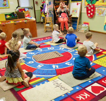 Adult teaching children