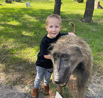 Little boy with a baboon